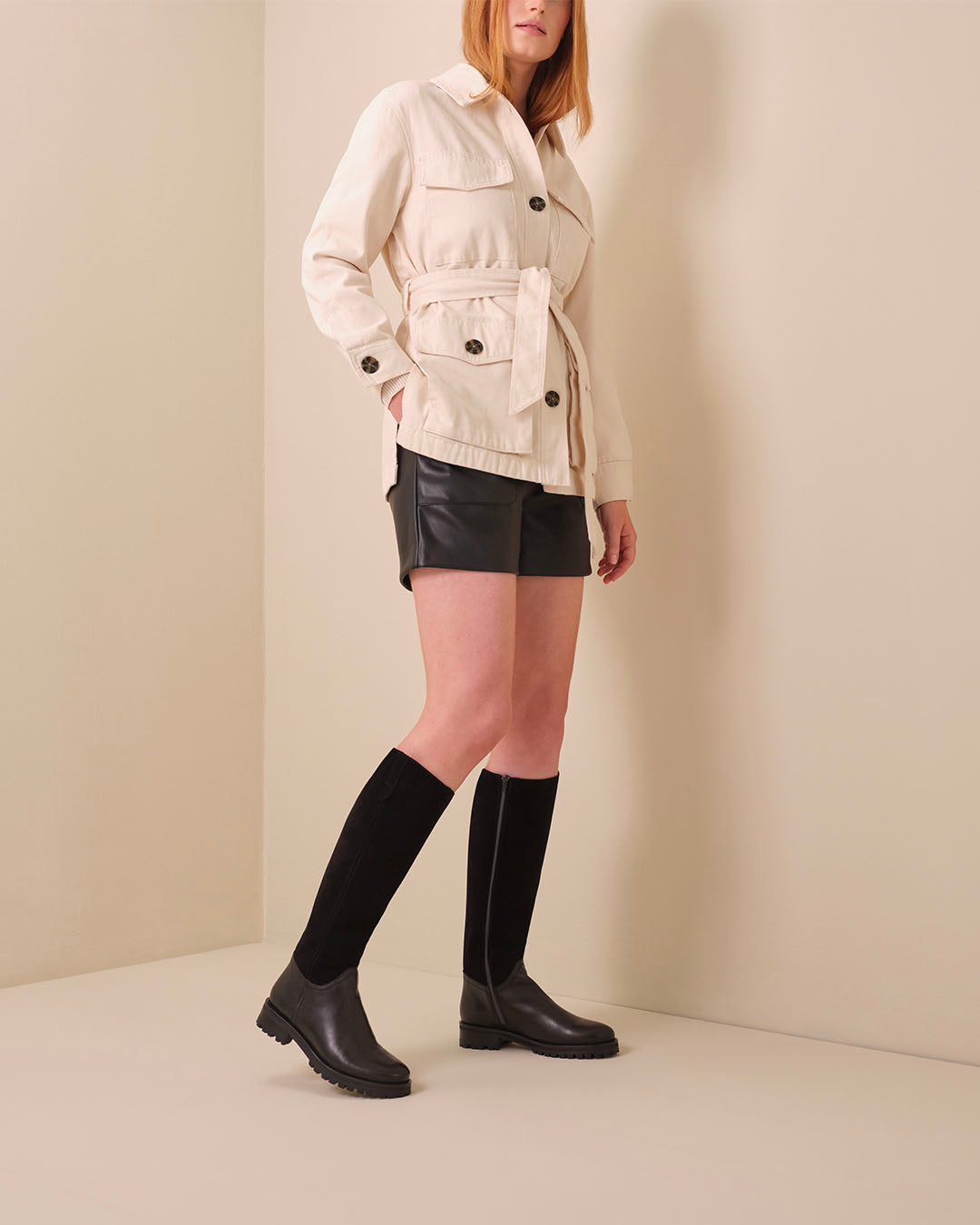 Woman In Black Shorts Styled With Jeane Black Suede Knee High Flat Boots DuoBoots
