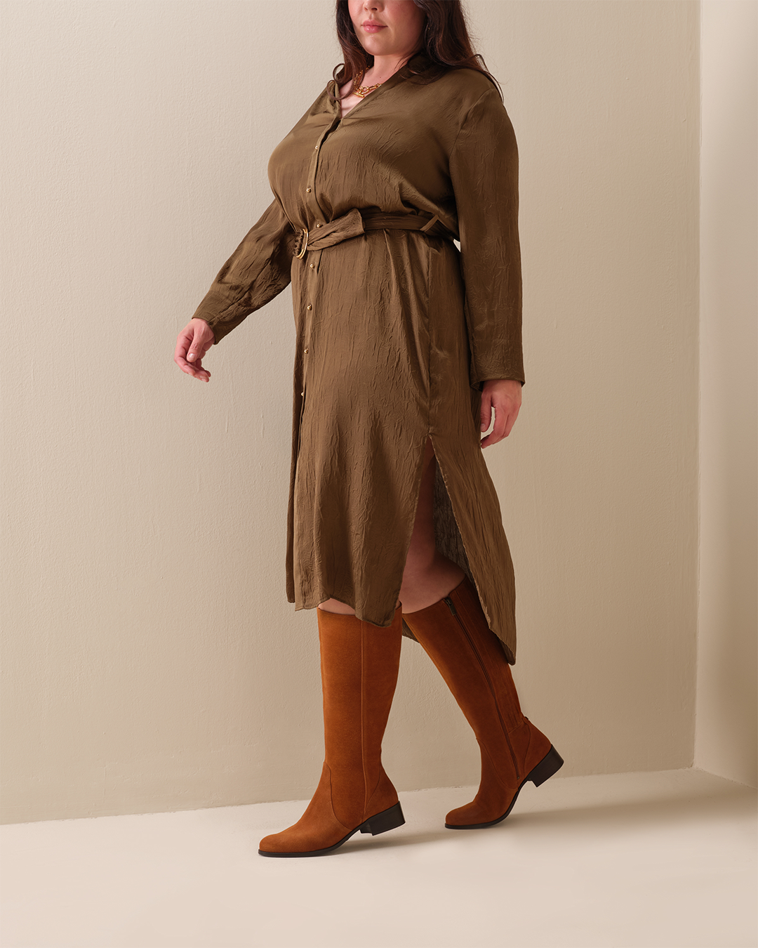 woman wearing knee high tan suede flat boots